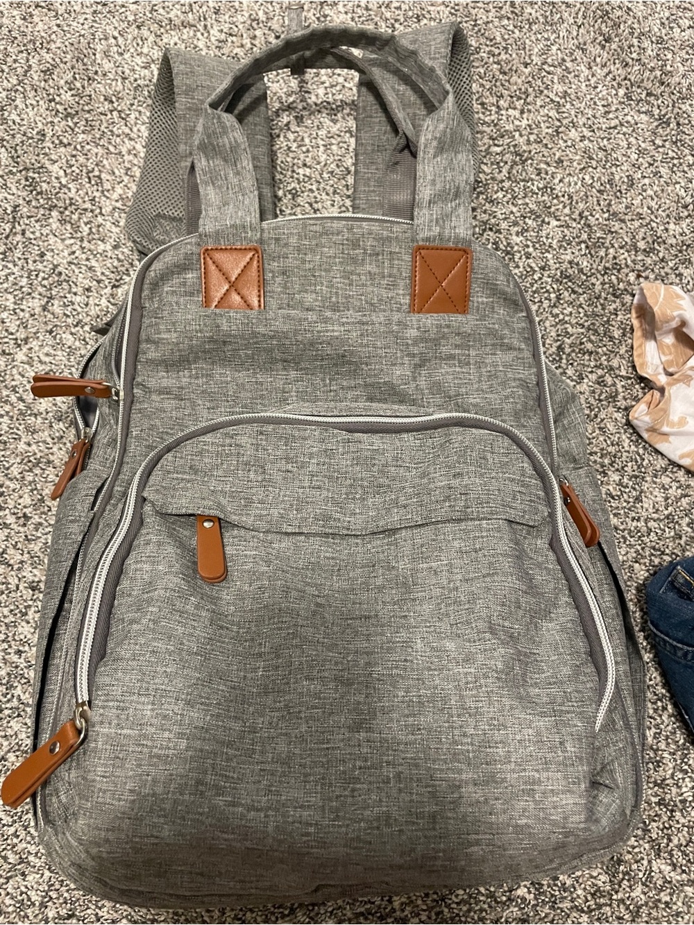 Gray backpack diaper bag with changing pad